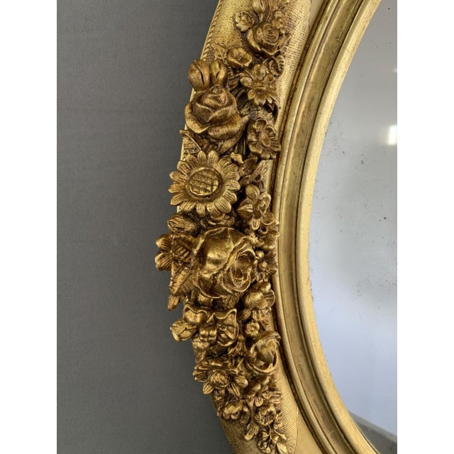 19th Century Gilded Mirror with Floral Motifs, 1890s, in Very Good conditions. Designed 1890 to 1919