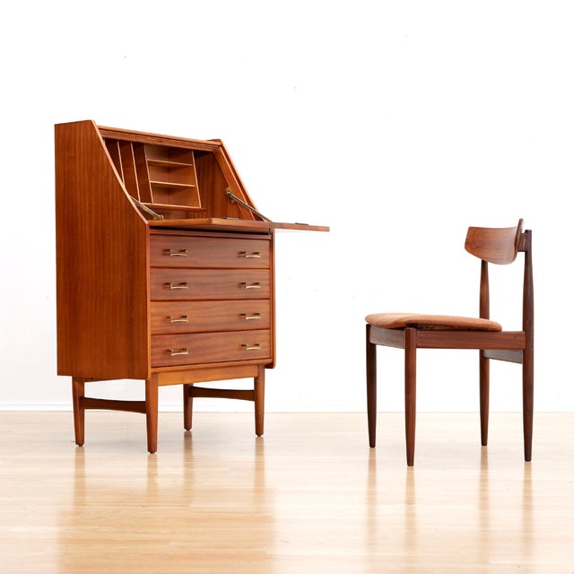 This fabulous mid century desk/cabinet was manufactured in England during 1960s. The mahogany cabinet has a warm, rich...