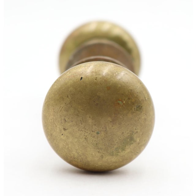 Vintage Classic style passage door knob made of brass. Priced as two door knobs, two rosettes, and a spindle. Good...