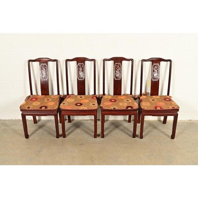 An outstanding set of four antique Chinese dining chairs China, Circa 1890s Gorgeous carved rosewood, with exquisite...