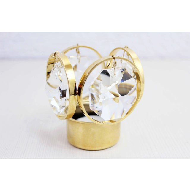 Designed with the same materials as its chandeliers, this candlestick combines crystal and gold-plated metal. The result...