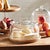 With a classic shape and simple handle, this cloche houses cheese, pastries or rolls. Sitting atop a natural wood board,...