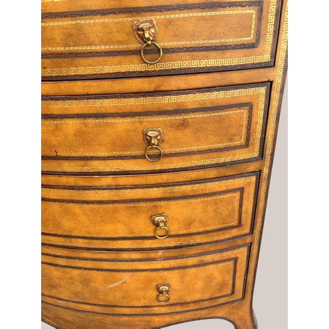 A superb Fully Leather Wrapped Bow Front Batchelor Chest. A Chest of Drawers with 2 small and 3 large drawers. The leather...