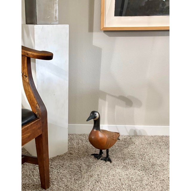 This CANADA GOOSE is intricately hand-painted together with glass eyes. It is signed on the bottom of the feet by the...