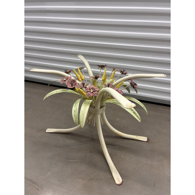 This vintage Italian coffee table features a distinctive bouquet of painted metal flowers and wheat stalks as its central...