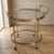 Prestigious two-tier bar cart in gilded brass and crystal, attributed by its lines and finishes to the neoclassical style...