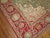 A highly decorative, artistic forest green colored ground Turkish Oushak with a cherry red medallion and border. Beautiful...