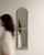 A mirror whose whitewashed/gray distressed frame, tall gives it real character at first glance. It was made in France...