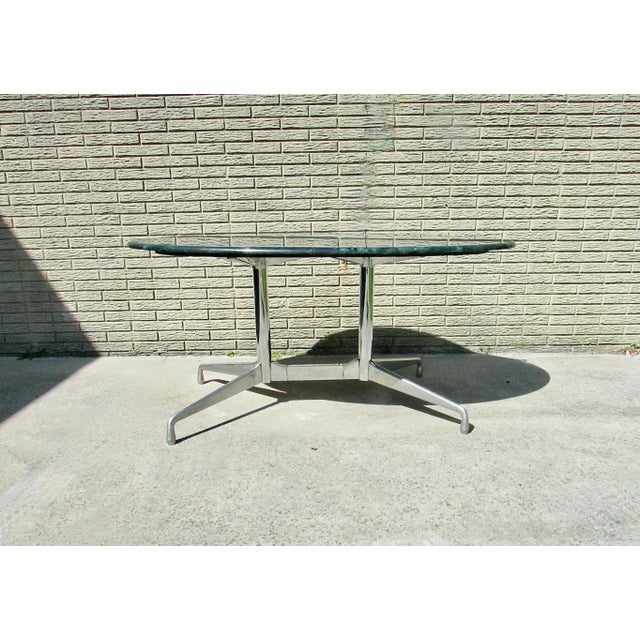 Aluminum Group segmented base table . Sometimes referred to as H base table . Designed by Charles and Ray Eames office...