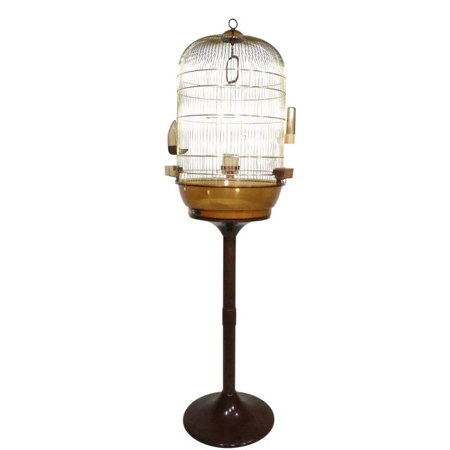 Groovy Space Age floor standing birdcage, featuring a dome top wire rod brass plated cage, with a translucent tinted...