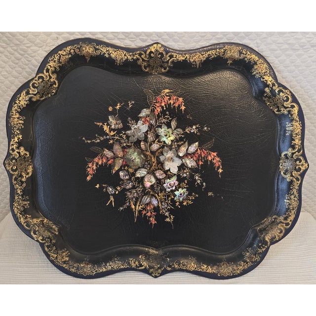 Elegant antique English Regency table featuring a richly lacquered black surface with hand-decorated floral and foliate...