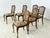 Six elegant Chippendale dining chairs in a classic style are for sale. The chairs impress with their curved legs,...