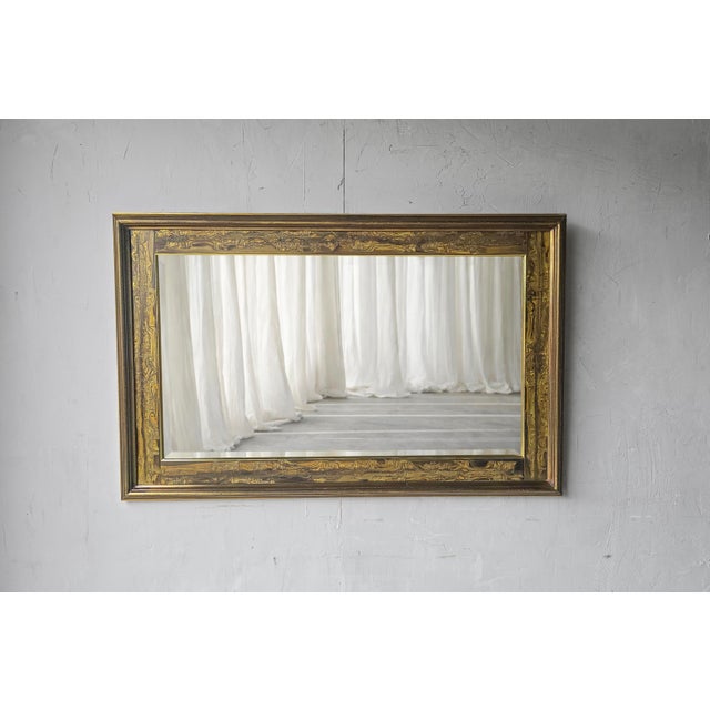 This gorgeous brass wall mirror is a 1970's masterpiece designed by Bernhard Rohne for Mastercraft. A large beveled...