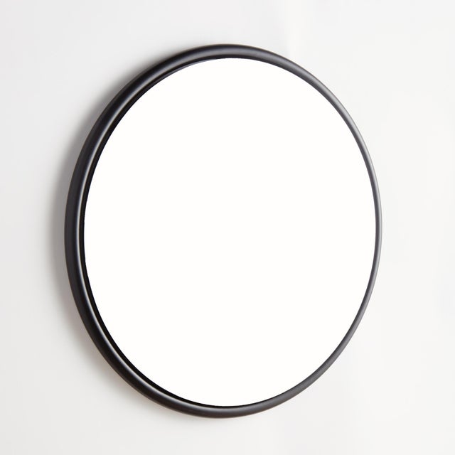 This sleek round iron stock frame in black is an inspired look. With a beveled edge, this stylish mirror creates a bold...