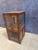 Add a touch of rustic warmth and timeless character to your space with this charming vintage-style wood and glass curio...