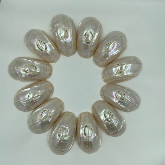 A striking set of twelve oversized natural mother of pearl serving bowls, traditionally used for caviar service but...