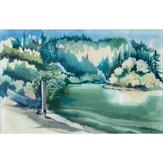 Watercolor painting of a boat pulled up on a lake shore. Signed "E. P. Blackburn" lower right corner. Presented in an oak...