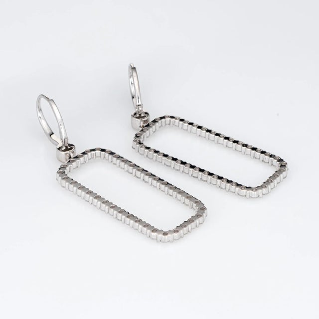 This is part of Chairish’s Fine Jewelry assortment. Elegant pair of diamond drop earrings crafted in 18k white gold. Round...