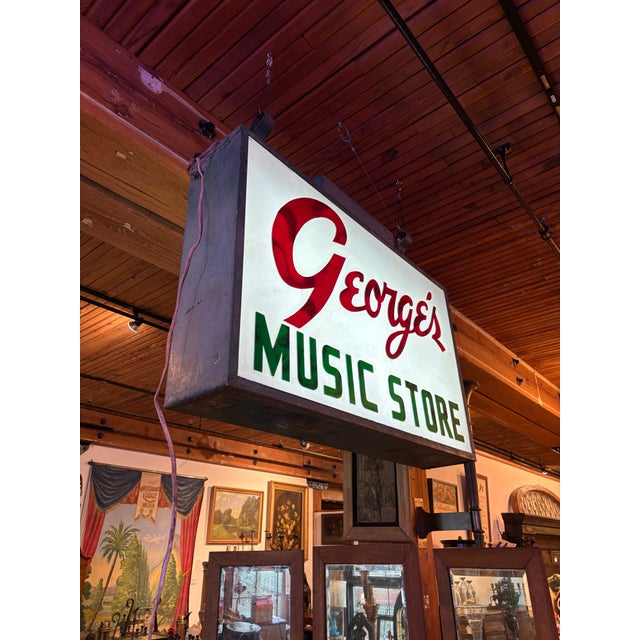 Classic large mid-century light box sign for "George's Music Store." Double-sided with beautiful typography made from...
