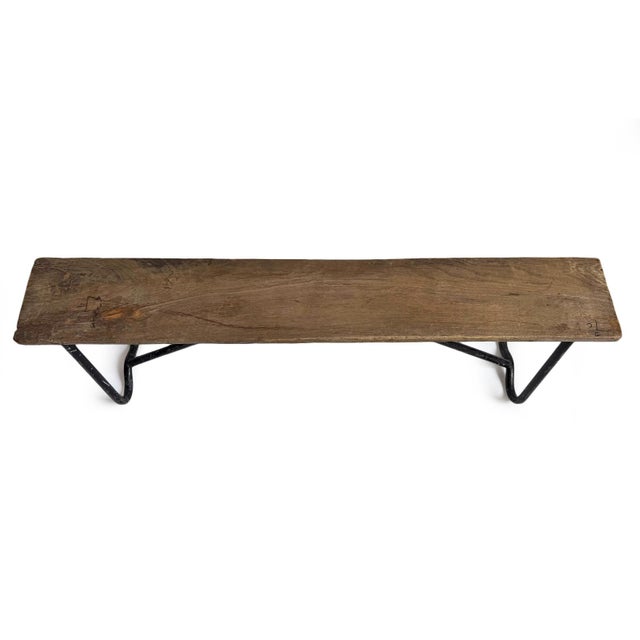 Vintage rustic wood and iron school bench. Characteristic signs of age and use add to the unique and special qualities of...