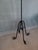 Wrought iron floor candlestick with five arms.