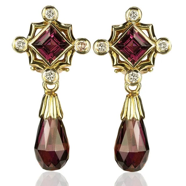 14k Earrrings with 4 rhodolite garnets and 0.34 carats of round diamonds. 11.32 grams