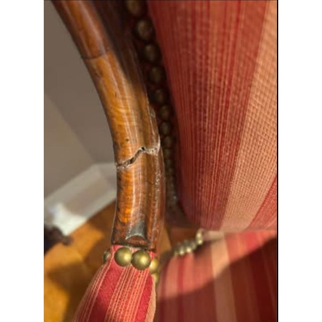 Straight from France, these armchairs feature a classic French Louis Philippe style with a beautiful red/orange upholstery...