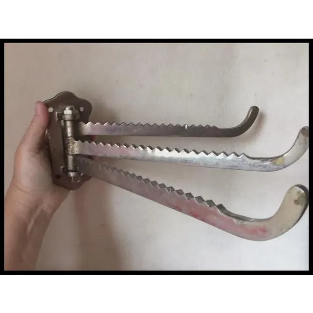 An Antique Industrial wall mount Architectural Wall Hook or Hanger. The Hooks are made from nickel plated brass and has a...