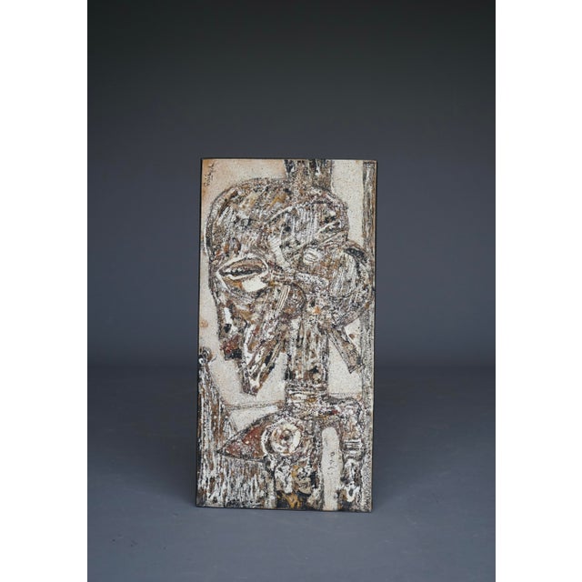 Georges Ebrin Adingra (1933–2005) was an Ivorian painter (born in Adaou) known for merging European Cubism with African...