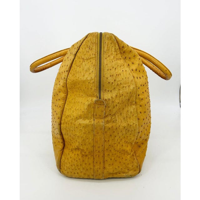 Vintage Gold Pfeil Mustard Tan Ostrich Leather Duffel Travel Bag Tote c1980s in fair condition. Beautiful mustard yellow...