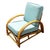 This beautifully restored Paul Frankl inspired rattan lounge chair features a triple-strand half-moon arm design with...
