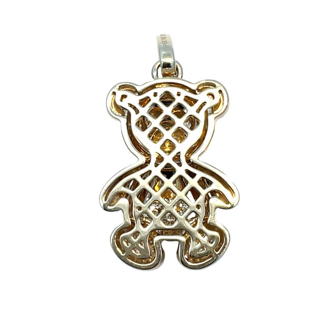 Charming and playful 14k yellow gold teddy bear pendant featuring sparkling diamond accents. The eyes are set with black...