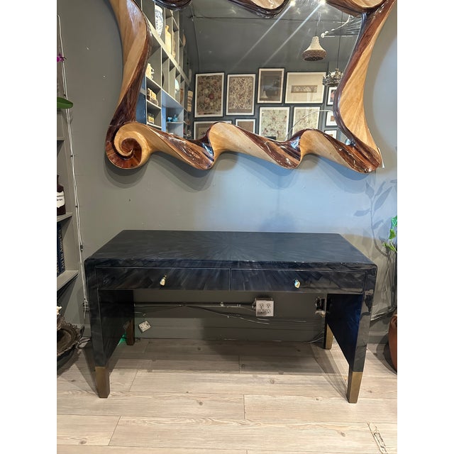 This desk has a sleek silhouette with a faux horn polished surface in dark gray and black with brass legs and drawer...