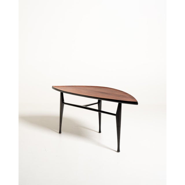 Teak coffee table with a distinctive asymmetrical top and black lacquered wooden frame. Yngve Ekström for Westbergs...