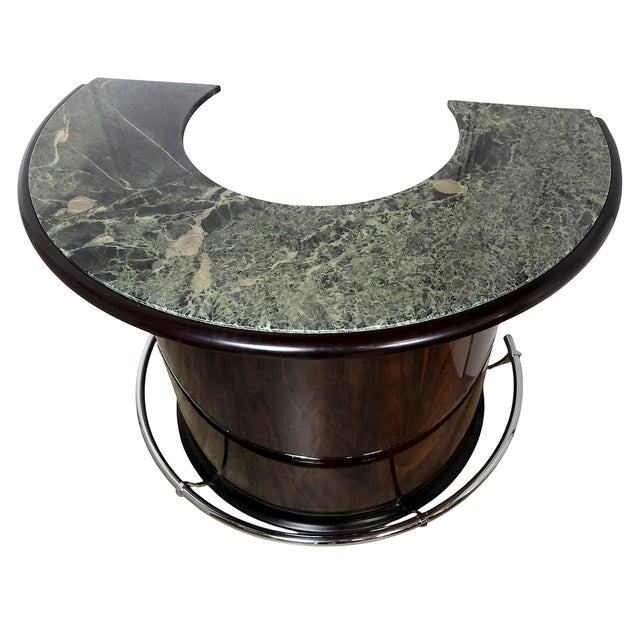 Vintage Italian bar with 4 pieces of stools. The semi-circular bar is created in walnut veneer with green marble top,...