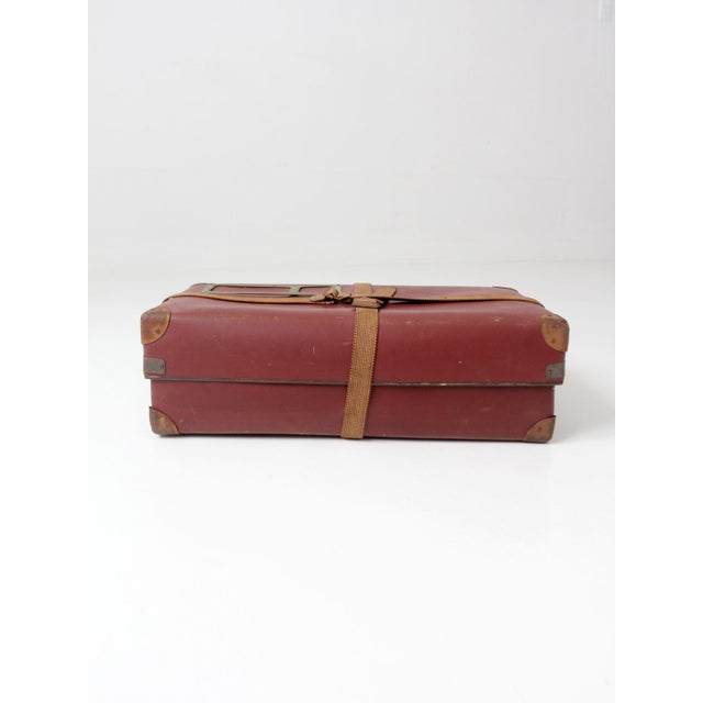 This mid-century mailing box features a durable vulcanized fiber body with woven web straps, riveted metal corner...