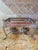 Vintage silver-plated footed double chafing dish frame featuring two fuel holders for sterno cans. It has beautiful ornate...