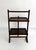 Circa 1900 - 1920s, this solid oak English metamorphic table features two rectangular wood shelves designed to function as...