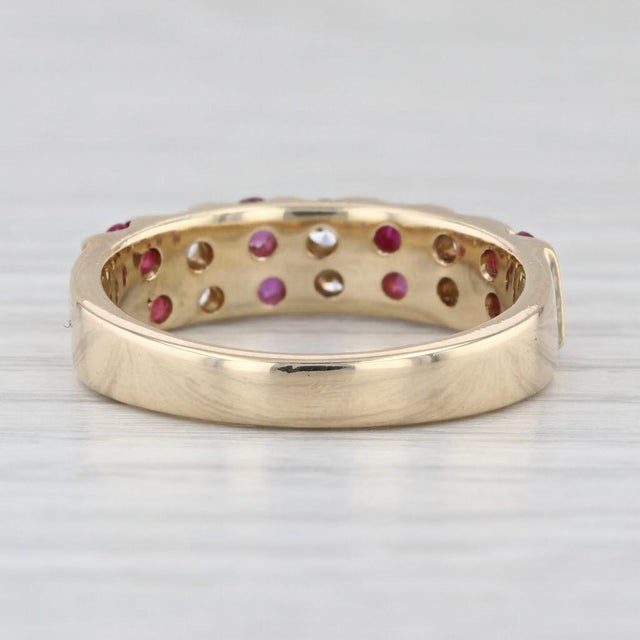 Gemstone Information: - Natural Rubies - Total Carats - 0.50ctw Cut - Round Color - Red Treatment - Routinely Enhanced -...