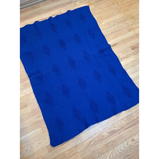 Beautiful cobalt blue hand knit mid century afghan throw blanket. Simple, yet geometric, this blanket contains the...