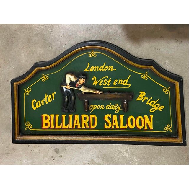 Decorative 3D relief wooden wall sign. The sign features a carved and hand-painted illustration of a man playing billiards...