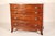George III or American Federal plum pudding mahogany bow front chest of drawers, circa 1800. With a single board D shaped...