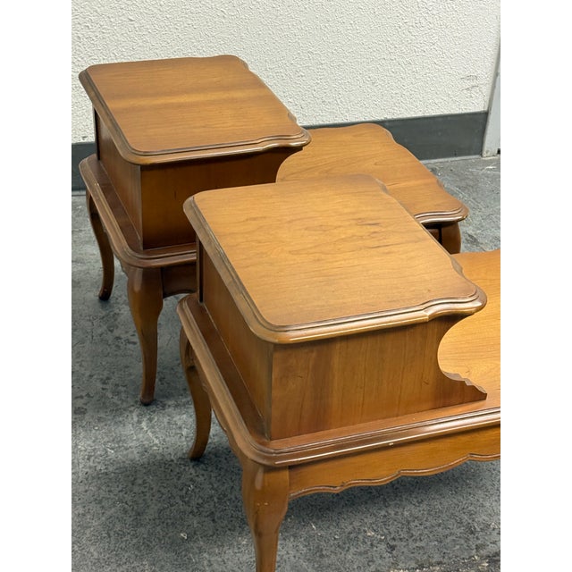 Design Plus Gallery presents a Pair of Nightstands from Bassett Furniture. They are made of solid wood with a honey brown...