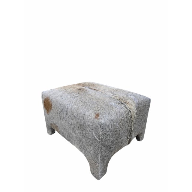 Vintage Rustic Modern Cowhide Ottoman Newly Reupholstered in Cowhide A stylish vintage rectangular ottoman newly...
