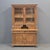 A classic antique early 1900s Eastern European, perhaps German, pine stepback 2-piece cabinet that would be perfect in a...