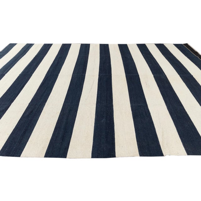Beautiful 21st century contemporary Kilim rug, handwoven wool in an all-over blue and white striped design. This rug...