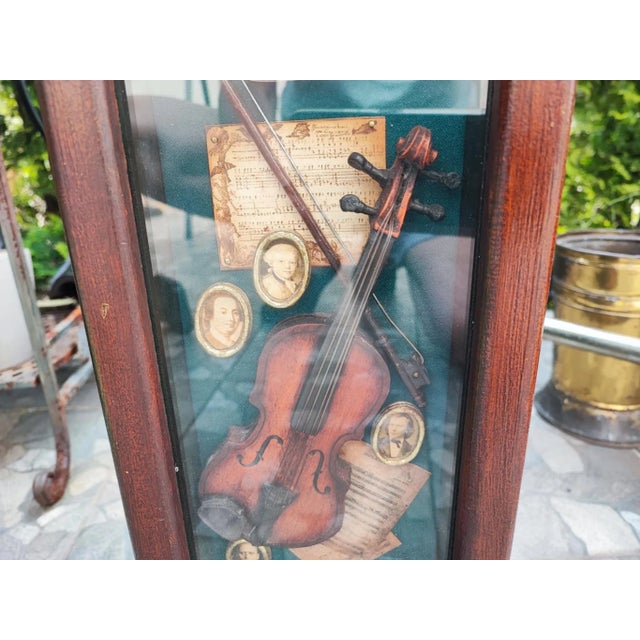 Wooden cabinet with violin, applications, 1950s, dimensions: width 24 cm, height 57 cm, depth 23.5 cm.