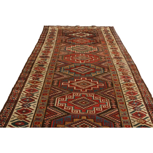Originating from Persia between 1890-1900, this antique Kurdish Persian runner features a distinguished combination of...
