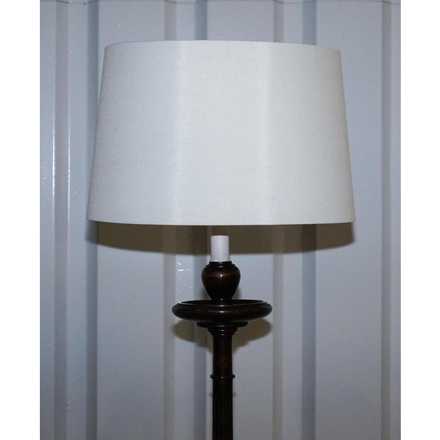 This distinguished antique Scottish floor lamp dates to the Victorian period and is crafted from solid oak, reflecting the...