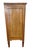 A lovely three-drawer chest in the Louis XVI style. It features a warm honey- toned finish and nice figured grain on the...